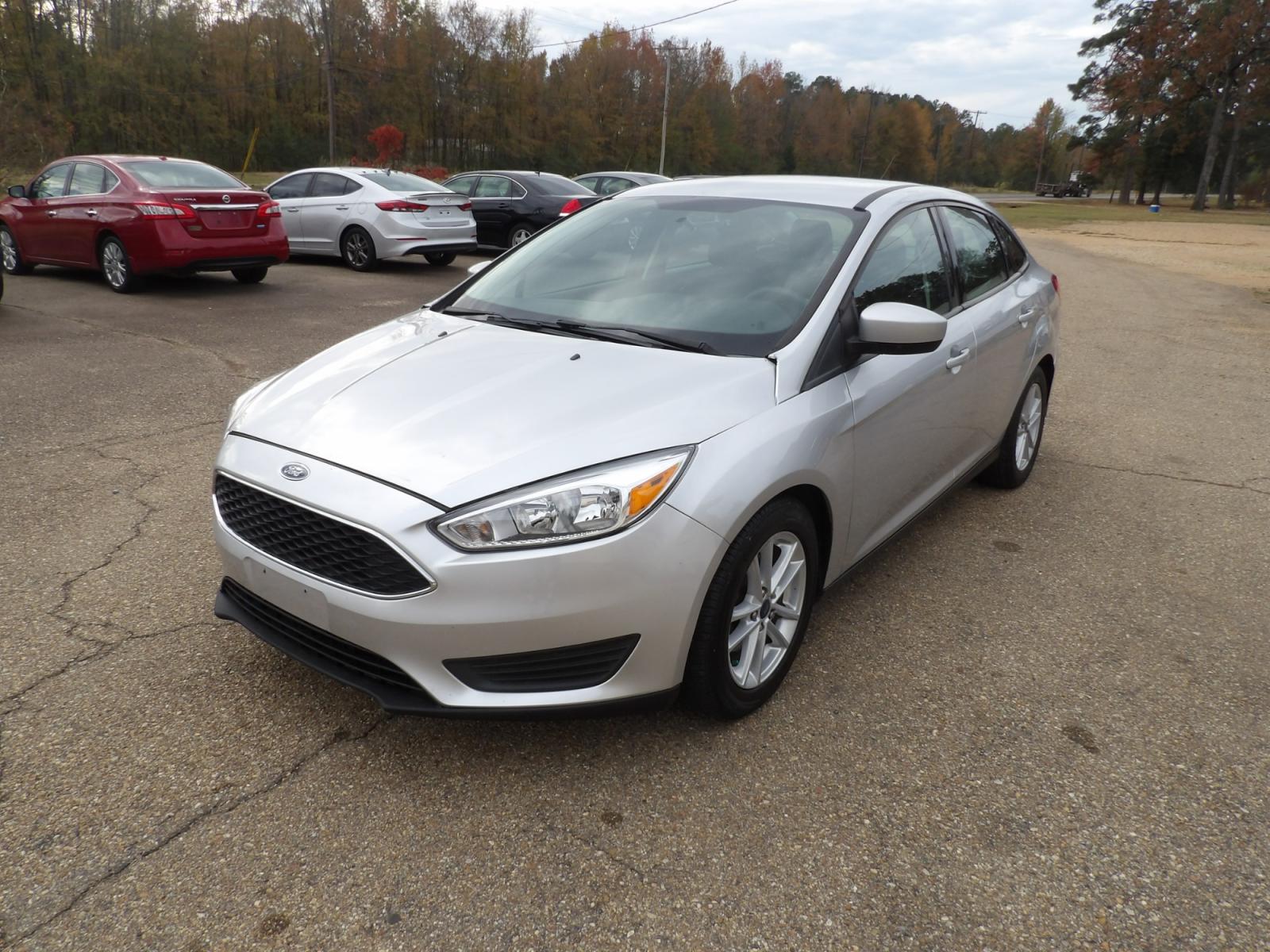 2018 Ingot Silver Metallic /Black Ford Focus SE (1FADP3FE4JL) with an 1.0L engine, automatic transmission, located at 401 First NE, Bearden, AR, 71720, (870) 687-3414, 33.726528, -92.611519 - Photo #0